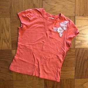 Orange flower appliqué shirt